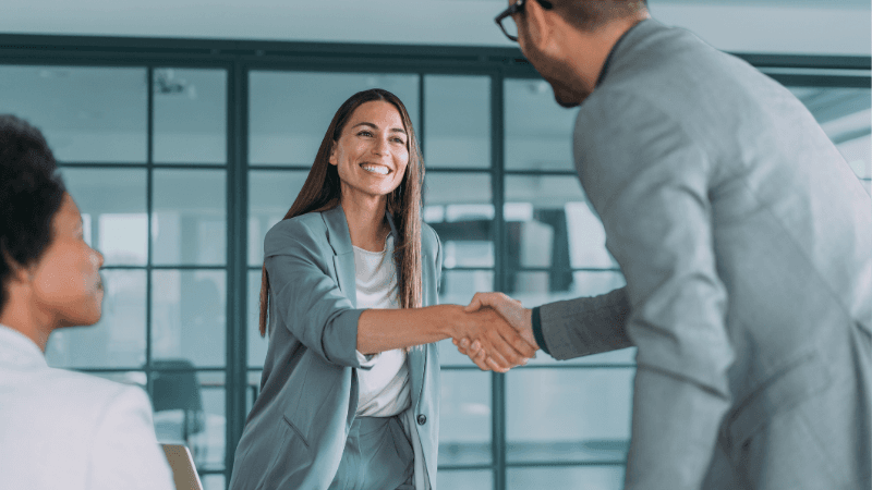 Professionals Shaking Hands in Job Interview