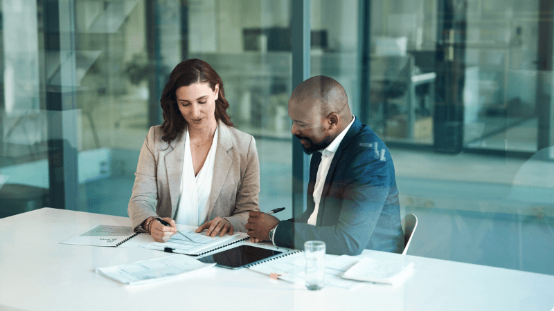 Associate And Counsel Recruitment Legal Professionals Reviewing Documents In A Modern Office, Representing Associate And Counsel Recruitment.