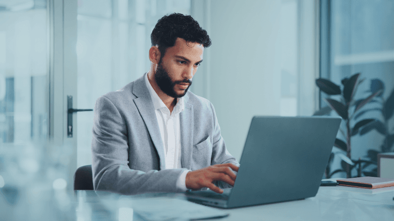 What Does A General Counsel Do Role, Responsibilities And Career Path General Counsel Sitting In Office Working On A Laptop