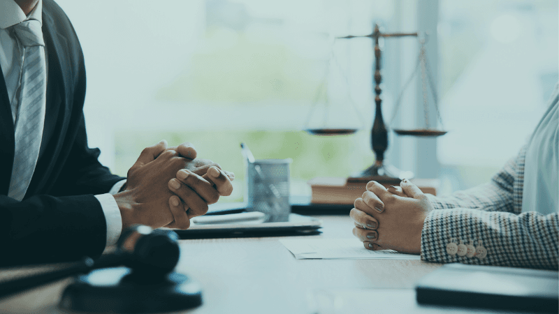 Larson Maddox Big Law Vs Mid Tier Big Law Associates In A Meeting With Gavel And Scales