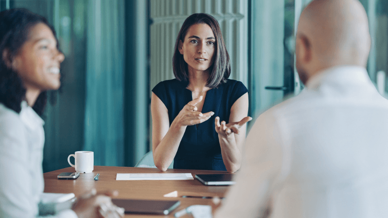 In House Counsel Recruitment In House Legal Professional Advising Business Stakeholders In A Modern Office Meeting.